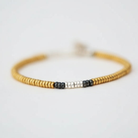 Gold Silver and Black Rhodium single strand beaded bracelet - Omo River