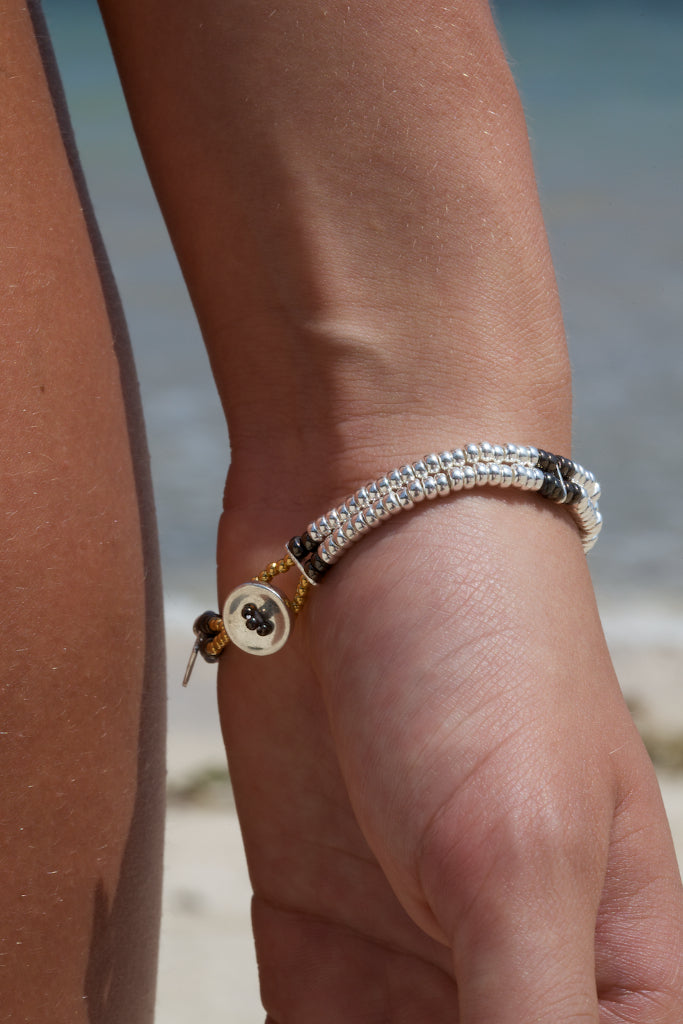 Sterling silver with 18 carat yellow gold  vermeil beaded double-strand button bracelet with black rhodium detailing. 