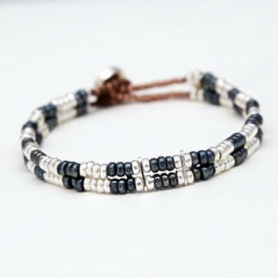 Black Rhodium, Sterling silver with 18 carat rose gold detailing beaded double-strand bracelet. Traditional beading technique