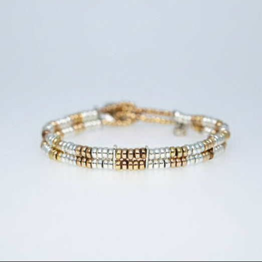 Sterling silver with 18 carat rose gold  vermeil beaded double-strand bracelet. Traditional beading technique.