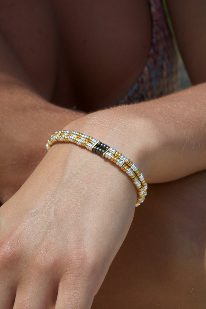 Sterling silver with 18 carat yellow gold  vermeil beaded double-strand bracelet. Black rhodium detailing. Nile River.