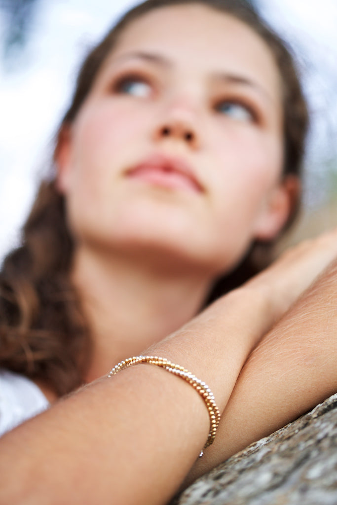 Elegant beaded bracelet. Three strand. 18k yellow and rose gold vermeil, Sterling silver. Suits any age. 